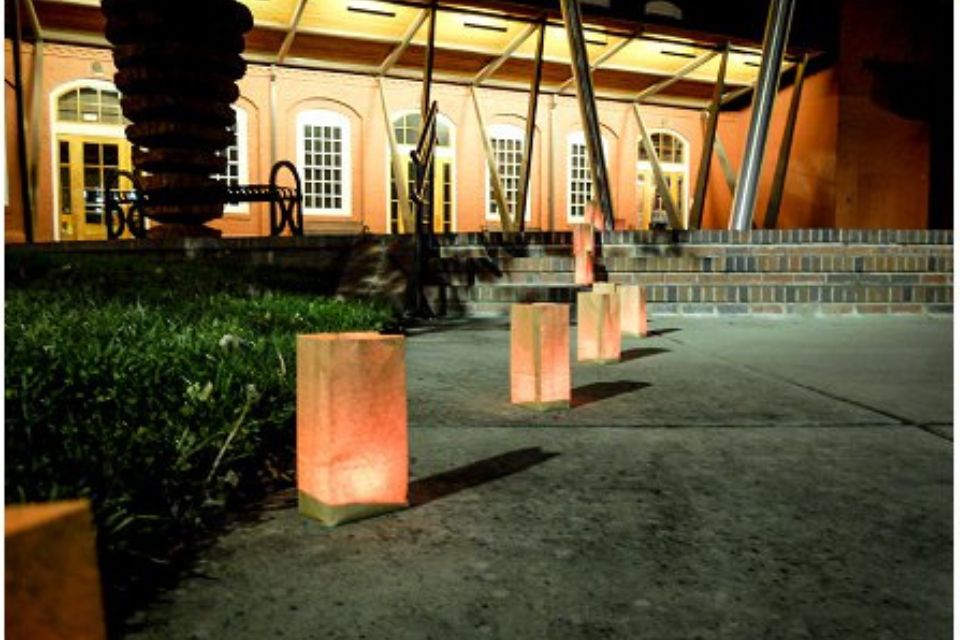 luminaries line the path to the building where Camp Canaan benefit is being held