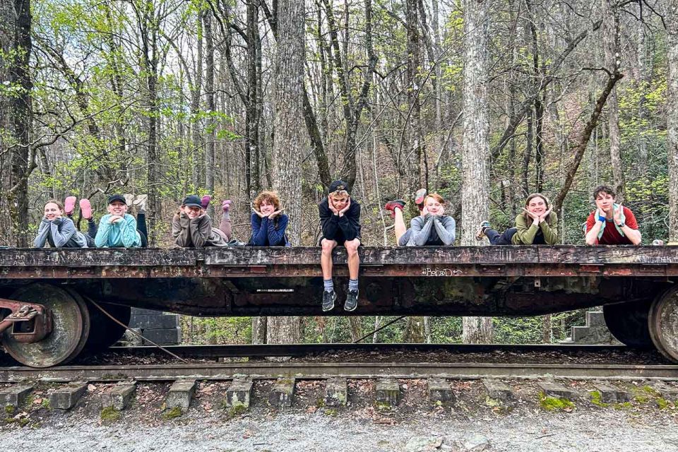 TLC campers pose on old train cart