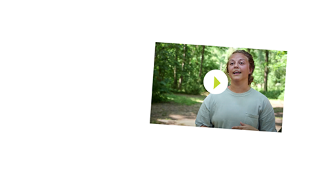 A person is standing outdoors with trees in the background, wearing a light green shirt. An overlay shows a play button, suggesting this is a video thumbnail from Camp Canaan's zipline canopy tour.