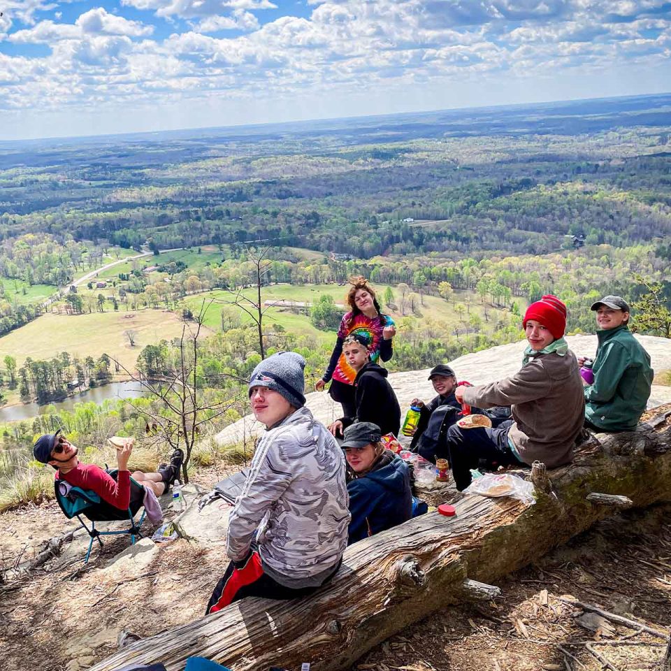 TLC campers enjoy the view at the summit of their hike