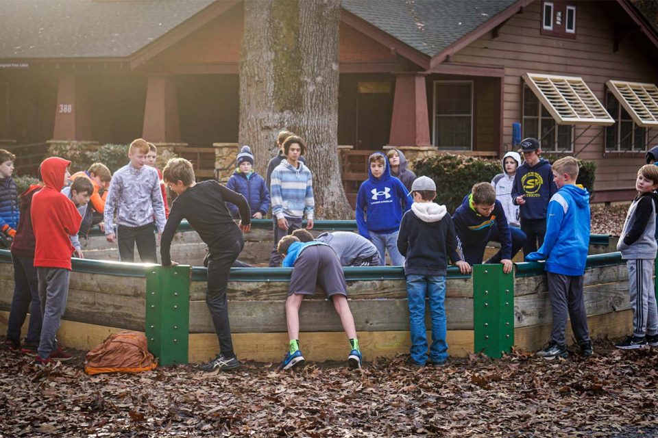 group of campers play GaGa ball in the GaGa ball pit during winter camp at Camp Canaan