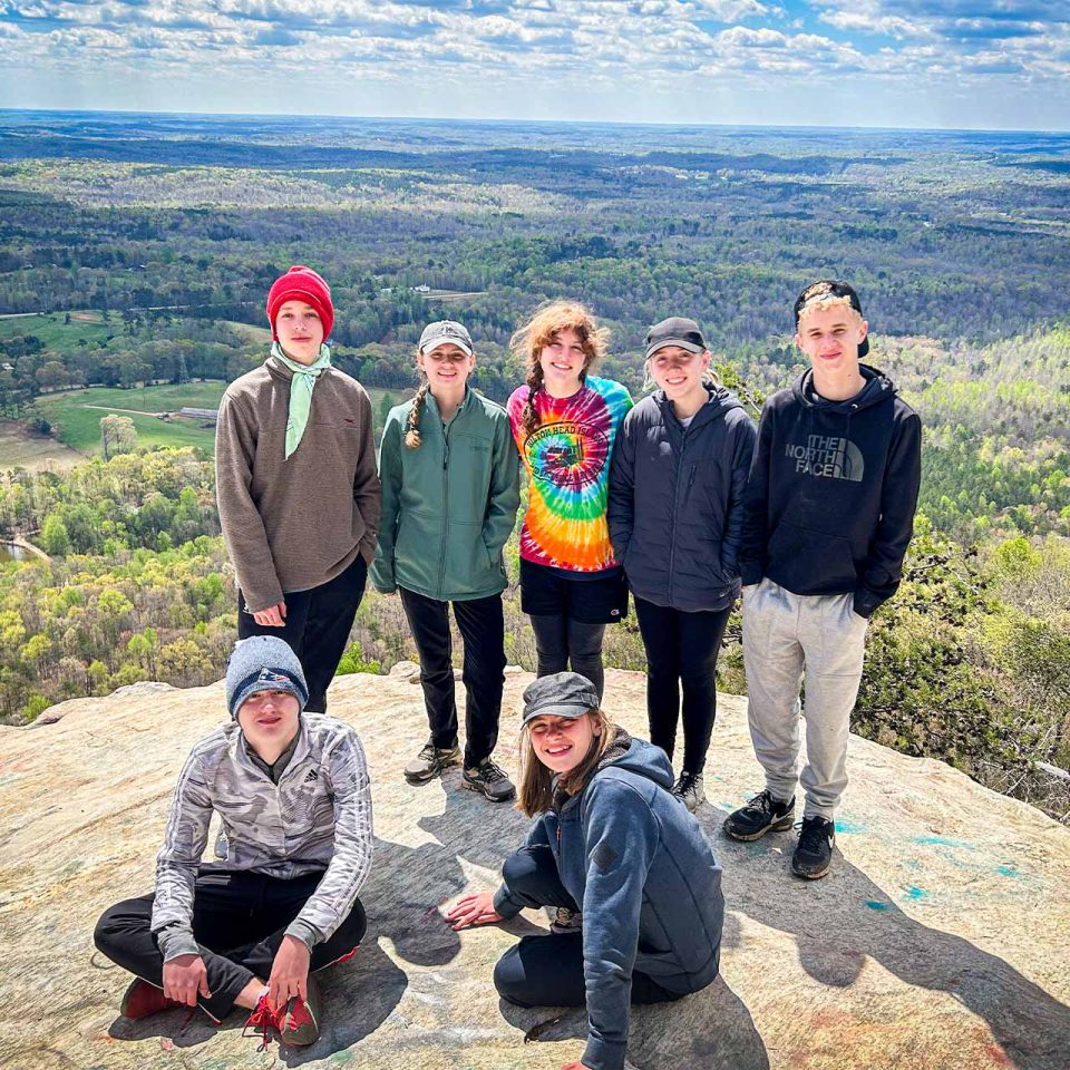 TLC campers pose after reaching the summit of their hike