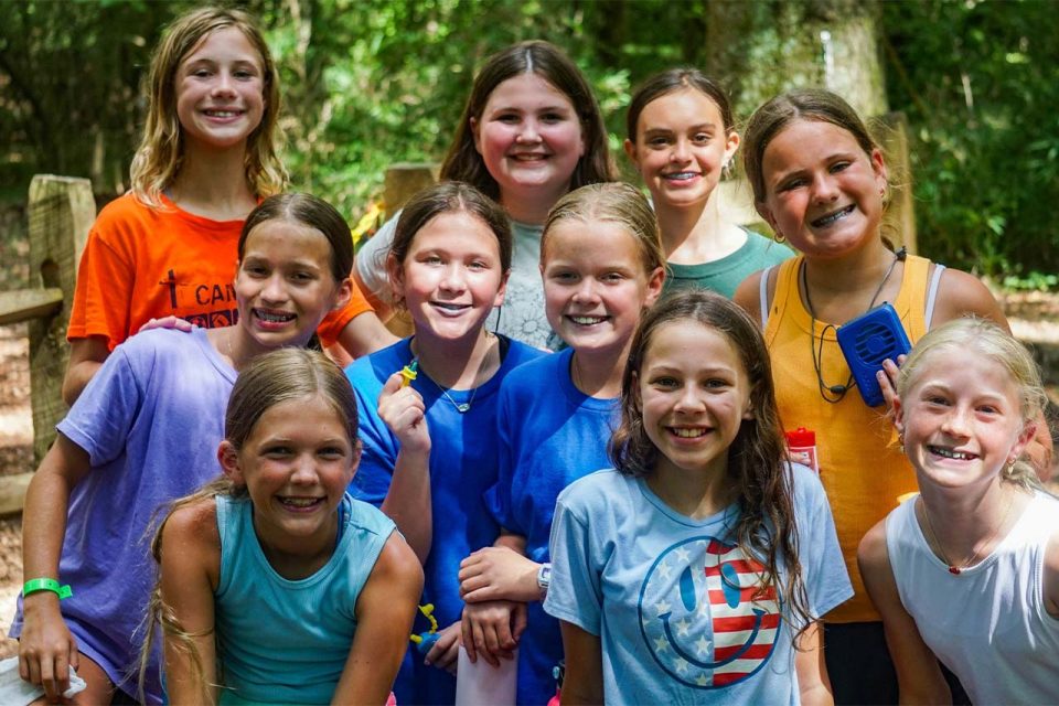 group of female senior day campers smile for the camera