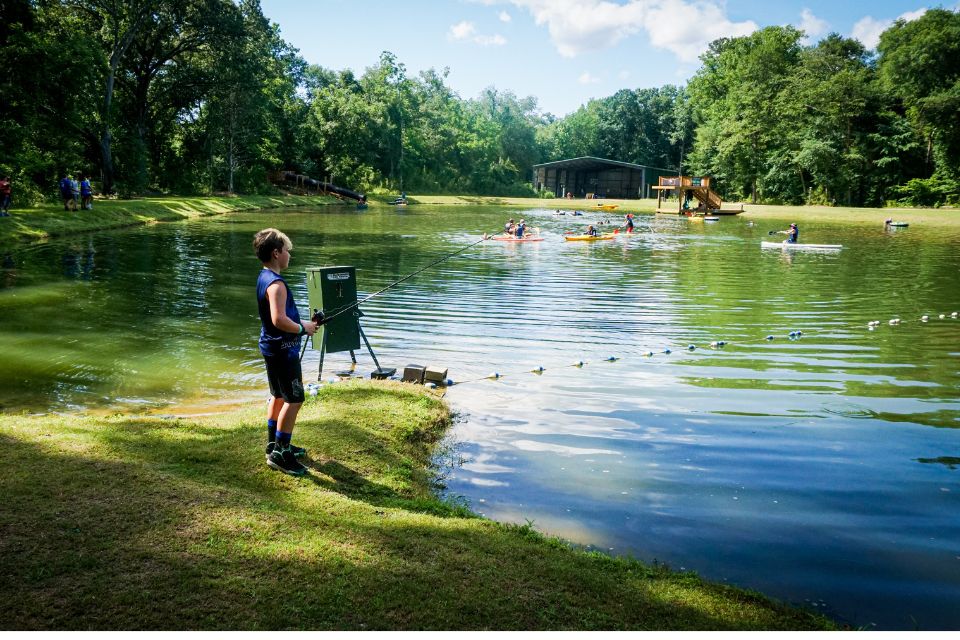 camper goes fishing at Lake Canaan during summer camp at Camp Canaan