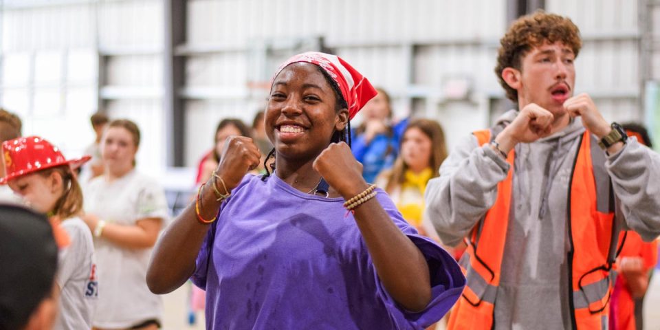 A group of counselors and campers dance during Morning Madness at Camp Canaan.